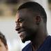 Michigan junior quarterback Devin Gardner smiles as he takes questions from the press during media day at the Al Glick Field House on Sunday afternoon. Melanie Maxwell I AnnArbor.com